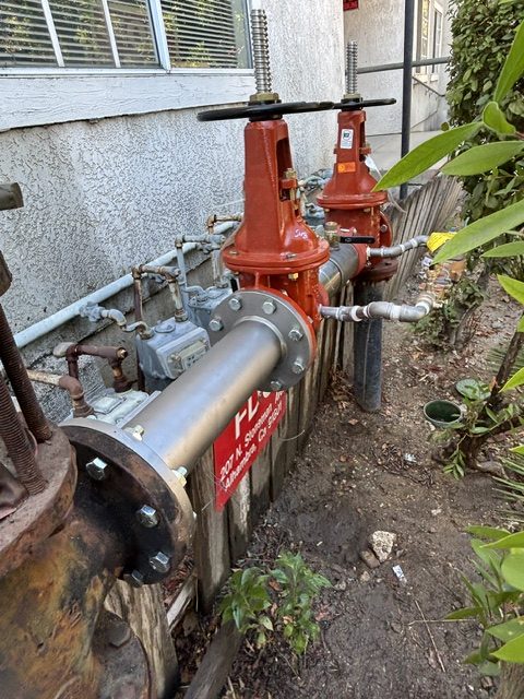 Newly installed fire service backflow prevention assembly on a concrete pad